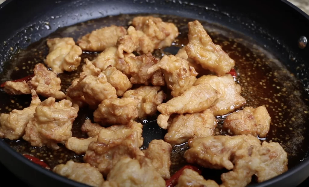 Coating the chicken thighs for General Tsos Chicken 